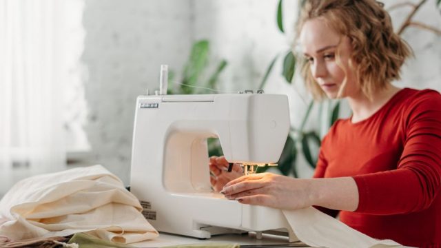 woman-using-sewing-machine